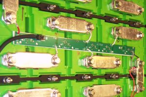 Cell boards mounted on prismatic cells